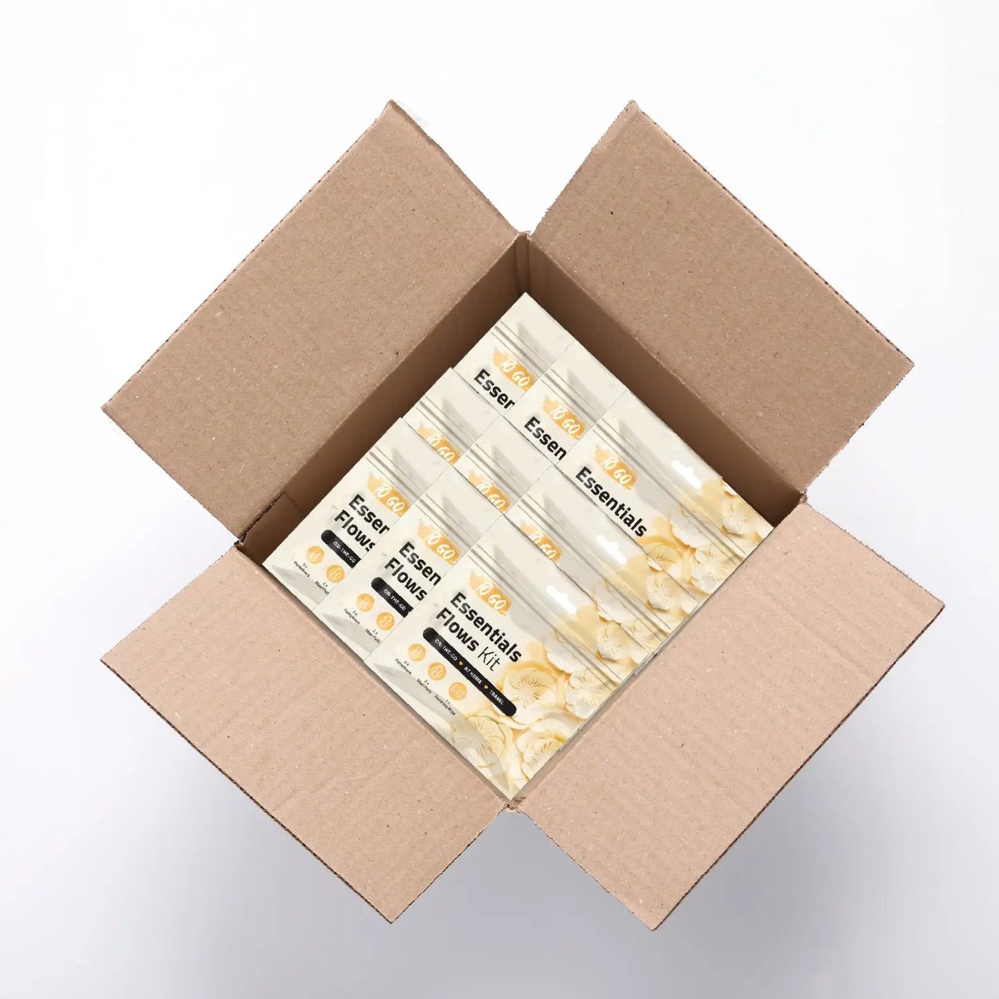 Case of 50 Orange Essential Flows Kits featuring feminine hygiene essentials for on-the-go, at home, or travel use.