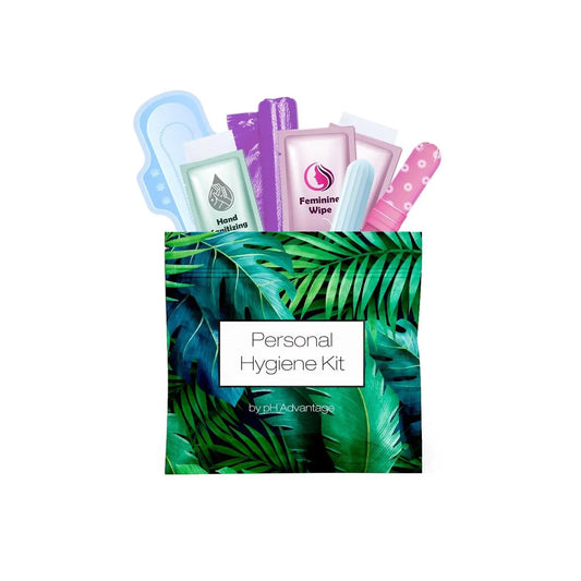Green Ferns Feminine Hygiene Kit shown upright with contents visible, including pad, tampon, feminine wipes, and hand sanitizing wipe.